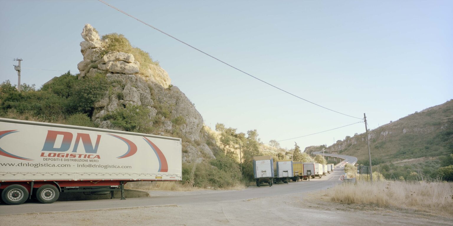 parked trucks waiting at italkali mine petralia soprana madonie paesaggi